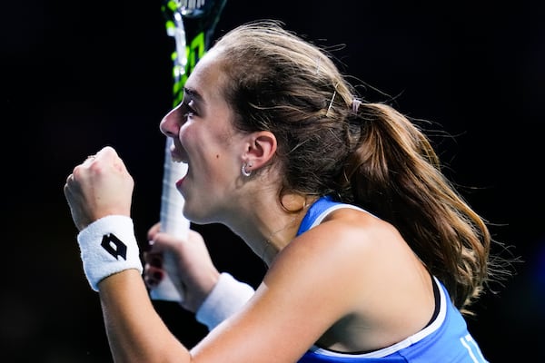 Italy's Lucia Bronzetti celebrates during the Billie Jean King Cup final against Slovakia's Viktoria Hruncakova at the Martin Carpena Sports Hall in Malaga, southern Spain, on Wednesday, Nov. 20, 2024. (AP Photo/Manu Fernandez)