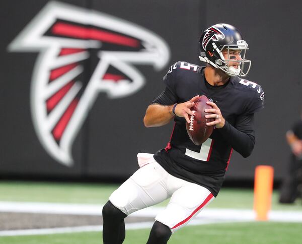 Falcons quarterback AJ McCarron looks to pass against the Tennessee Titans Friday, Aug. 13, 2021, in Atlanta. (Curtis Compton / Curtis.Compton@ajc.com)