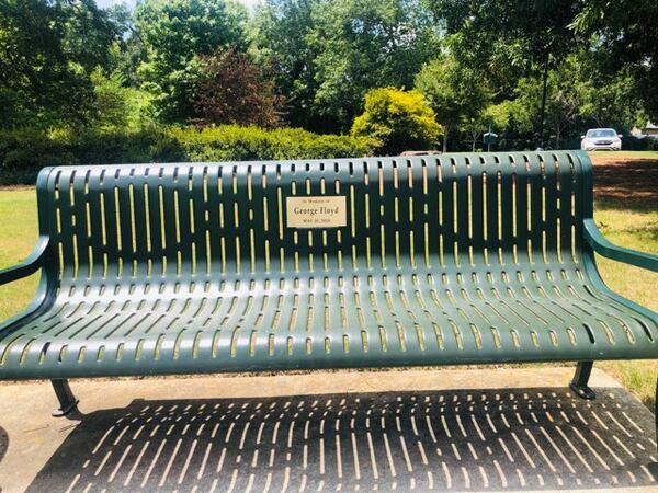 A Smyrna couple has dedicated three benches with plaques honor Ahmaud Arbery, Breonna Taylor and George Floyd. Credit: Damon Willis