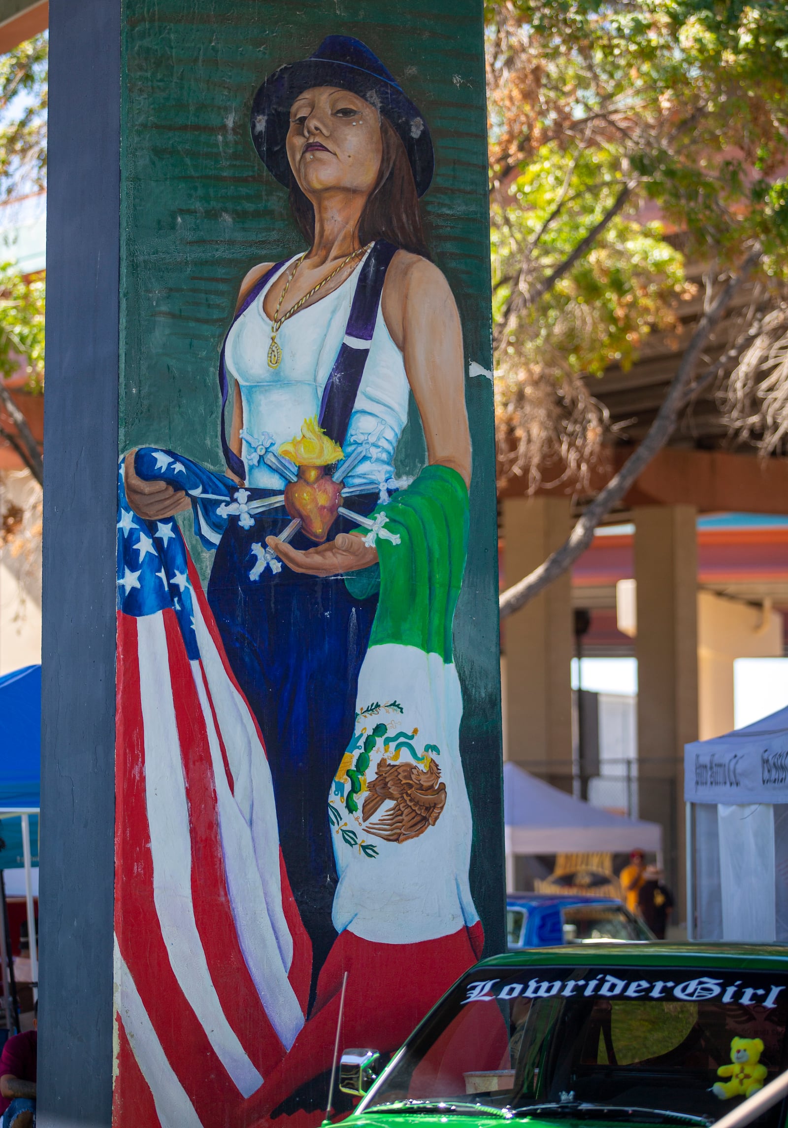 A mural depicting a Mexican American woman is pictured at Lincoln Park during a lowrider exhibition for its 20th anniversary in El Paso, Texas, Sunday, Sept. 22, 2024. (AP Photo/Andrés Leighton)