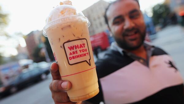 NEW YORK, NY - SEPTEMBER 13:  Jawad Rasur displays a 24-ounce iced latte he purchased at Dunkin Donuts in Manhattan after the New York City Board of Health voted to ban the sale of large sugary drinks at restaurants and concessions on September 13, 2012 in New York City. Rasur said, "It's stupid, it's taking away people's freedom. I'm adult enough." The controversial measure bars the sale of sugar drinks larger than 16 ounces in an effort to combat obesity. (Photo by Mario Tama/Getty Images)