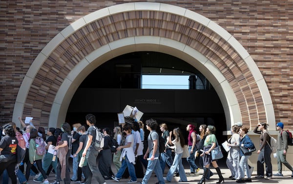 A few hundred Chapman University students take part in a walkout and protest Monday, March 17, 2025, against President Trump's policies, including immigration, DEI, and the students protest in support of Palestinians. (Mindy Schauer/The Orange County Register via AP)