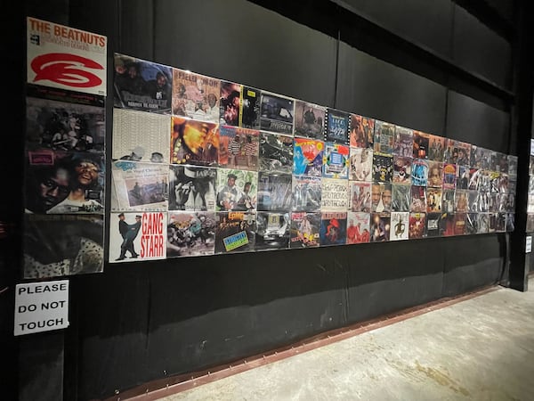 The album wall features over 280 records from EarWax Records' Darryl "Jasz" Smith.