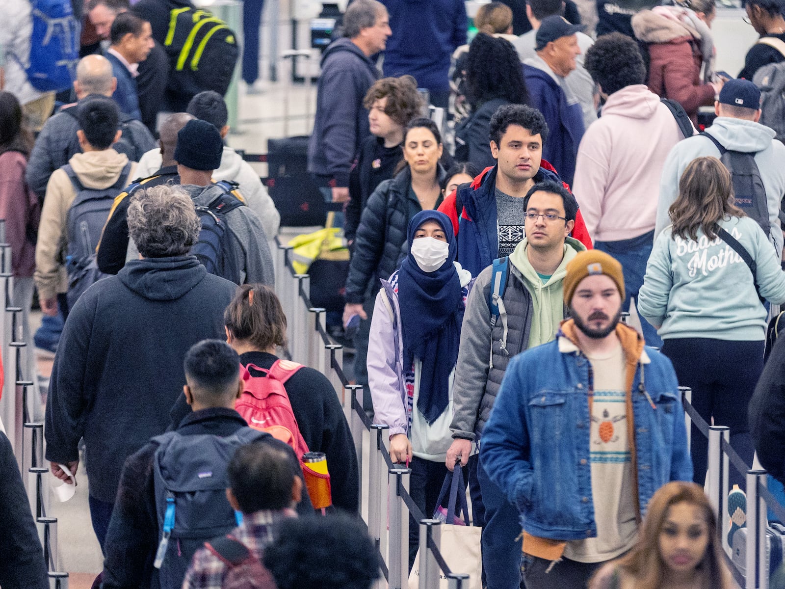 Travelers make their way to security at Hartsfield-Jackson Atlanta International Airport on Friday, which is expected to be the peak day for Christmas holiday travel  (Steve Schaefer/steve.schaefer@ajc.com)