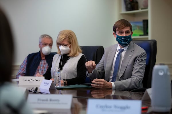 Neil Pruitt, Chairman and CEO of PruittHealth, right, told Gov. Brian Kemp on Monday, “Unfortunately, I think we’re going to be dealing with COVID for another six months.” (Photo courtesy of the Governor's Office)