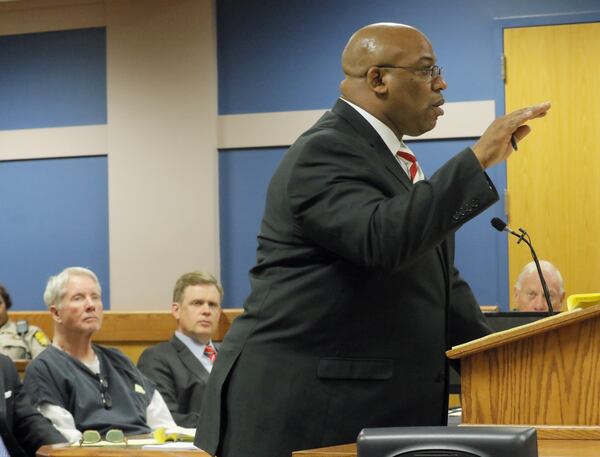 Tex McIver (left) watches as prosecutor Clint Rucker questions a witness during the hearing. BOB ANDRES /BANDRES@AJC.COM