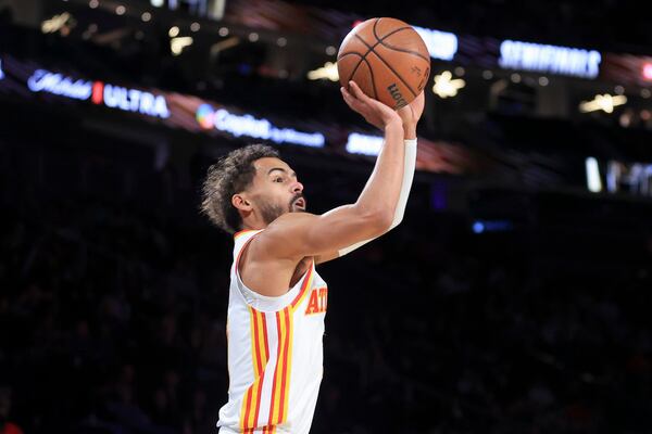 Atlanta Hawks guard Trae Young looks to shoot during the first half of a semifinal game against the Milwaukee Bucks in the NBA Cup basketball tournament Saturday, Dec. 14, 2024, in Las Vegas. (AP Photo/Ian Maule)