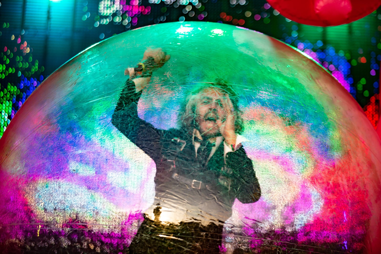 The Flaming Lips, featuring the lead singer in a bubble and inflatable giant robots on the Piedmont Stage, perform on the final day of the Shaky Knees Music Festival at Atlanta's Central Park on Sunday, May 7, 2023. (RYAN FLEISHER FOR THE ATLANTA JOURNAL-CONSTITUTION)