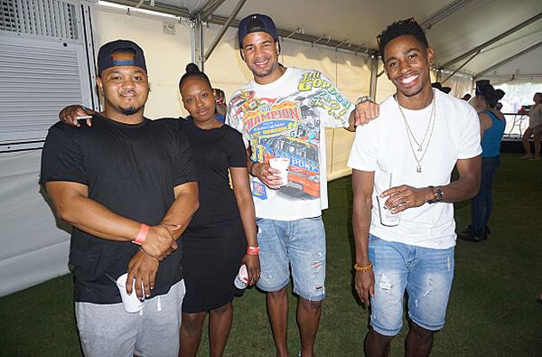 Miguel Abad (left), Victoria Watson, Sam Gaskin and Nick Mann take a moment for a picture at the Atlanta Summer Beer Festival.