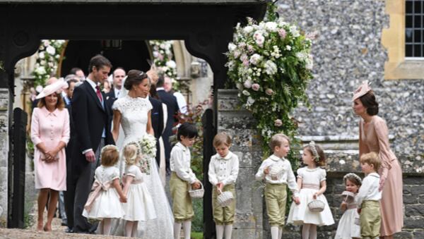 ENGLEFIELD GREEN, ENGLAND - MAY 20: Pippa Middleton and her new husband James Matthews are seen with Catherine, Duchess of Cambridge and her children Prince George of Cambridge and Princess Charlotte of Cambridge leave church following their wedding ceremony at St Mark's Church as the bridesmaids and pageboys walk ahead on May 20, 2017 in Englefield Green, England.  (Photo by Justin Tallis - WPA Pool/Getty Images)