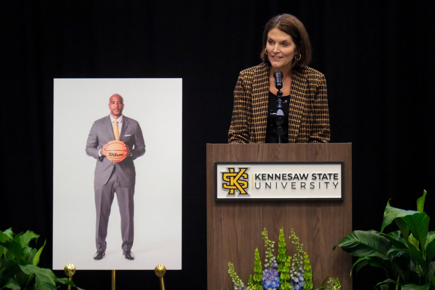 Kennesaw State University President Kathy S. Schwaig delivers remarks during a celebration of life for former KSU basketball coach Amir Abdur-Rahim at the KSU convocation center on Sunday, Oct. 27, 2024.   Ben Gray for the Atlanta Journal-Constitution