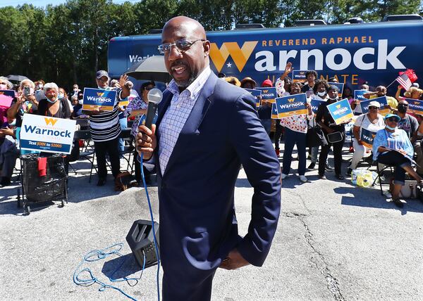 U.S. Sen. Raphael Warnock speaks to supporters while making a campaign stop in Atlanta on  Sept. 26, 2022.  (Curtis Compton / AJC)