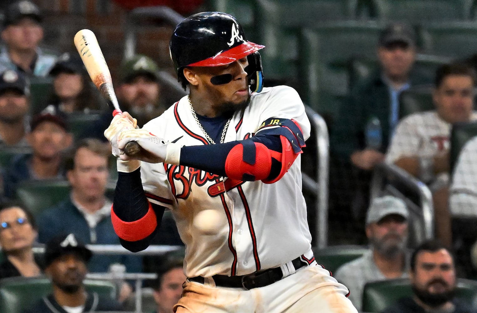 Atlanta Braves right fielder Ronald Acuna (13) is hit by a Philadelphia Phillies pitch during the sixth inning of game two of the National League Division Series at Truist Park in Atlanta on Wednesday, October 12, 2022. (Hyosub Shin / Hyosub.Shin@ajc.com)