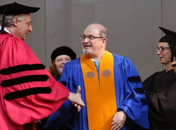 Salman Rushdie is congratulated as he receives an honorary Doctor of Letters degree. Author and human rights advocate Sir Salman Rushdie, a University Distinguished Professor at Emory, delivered the keynote address at Emory University's 170th commencement Monday morning, May 11, 2015. BOB ANDRES / BANDRES@AJC.COM