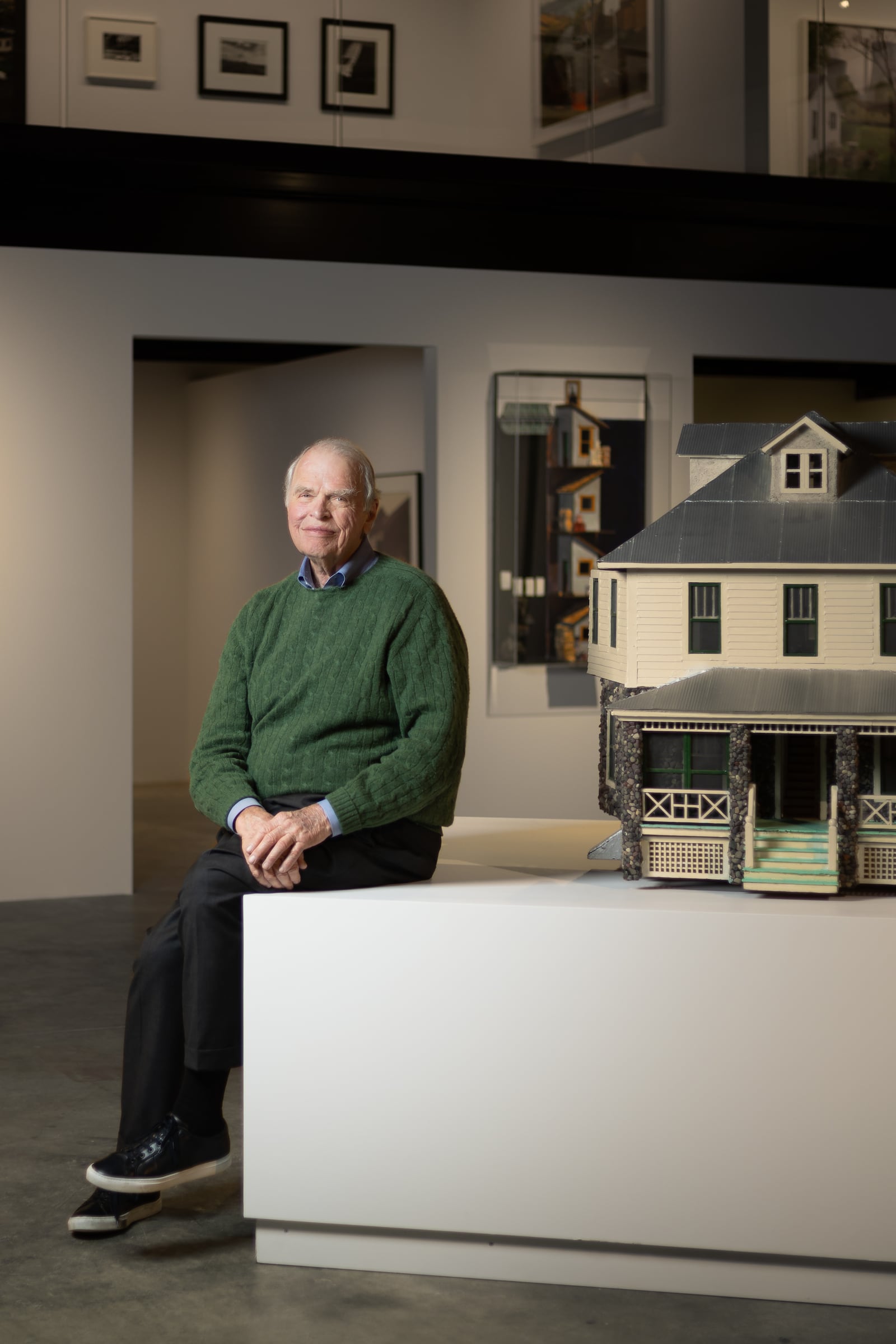 Wieland sits next to Robert Gober’s “Half Stone House” (1979-80) in the museum. Courtesy of The Wilbert Group