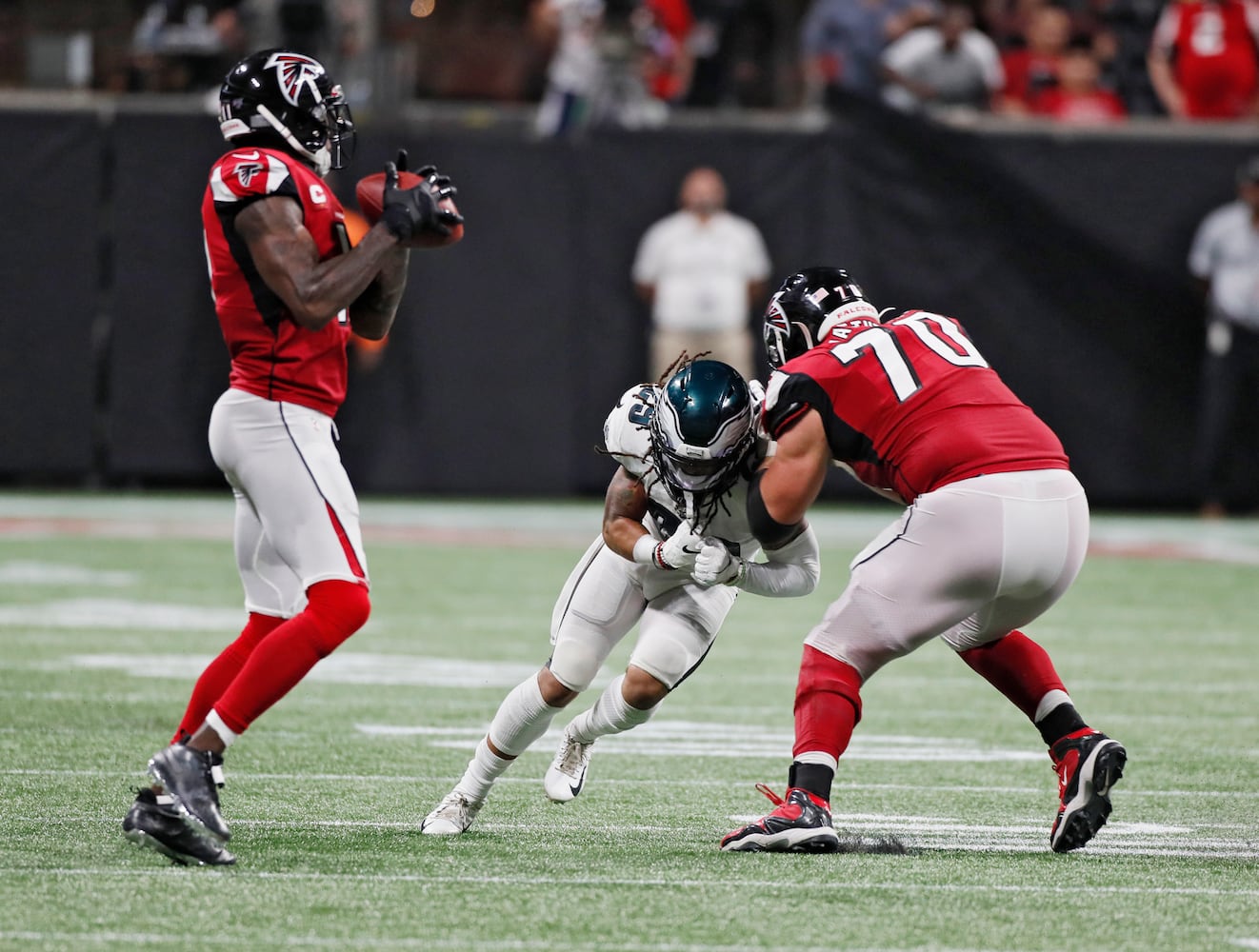 Photos: Falcons outlast Eagles for first win