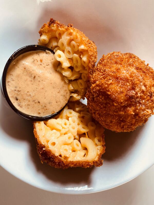 Macken cheese balls are made with elbow macaroni, cheese, panko and truffle cream sauce. Bob Townsend for The Atlanta Journal-Constitution 