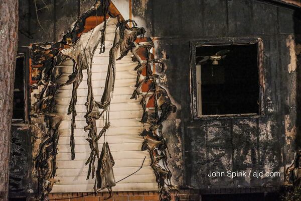 Five other people were able to escape this deadly house fire on Kimball Road in southwest Atlanta. JOHN SPINK / JSPINK@AJC.COM