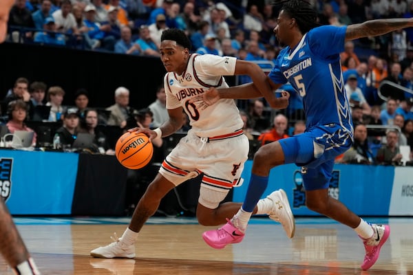 Auburn guard Tahaad Pettiford (0) drives the ball to the basket against Creighton guard Jamiya Neal (5) during the first half in the second round of the NCAA college basketball tournament, Saturday, March 22, 2025, in Lexington, Ky. (AP Photo/Brynn Anderson)