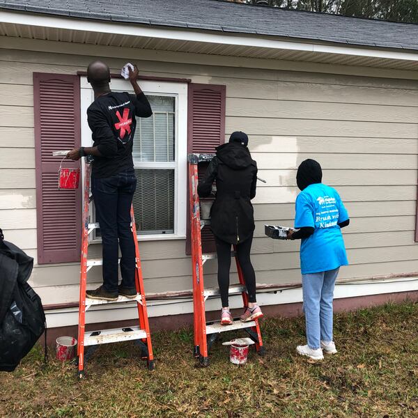 A Brush with Kindness volunteers from AiA help fix up a Habitat for Humanity home.