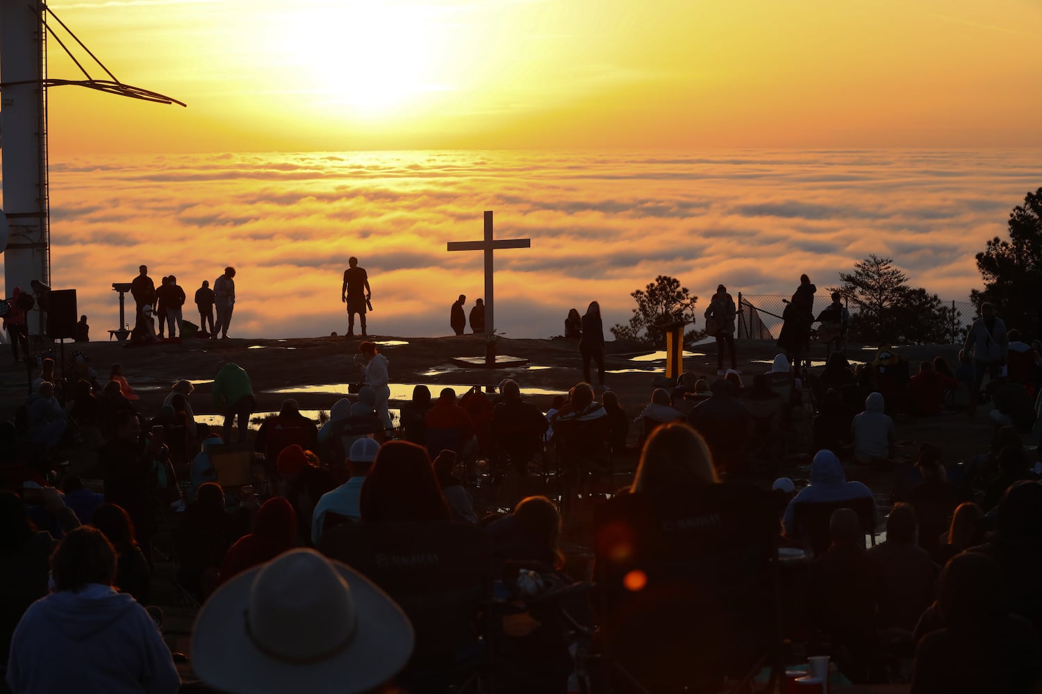 Crowds gather as the sun rises on top of Stone Mountain during the 76th annual Easter Sunrise Service on Sunday, April 17, 2022. Miguel Martinez/miguel.martinezjimenez@ajc.com