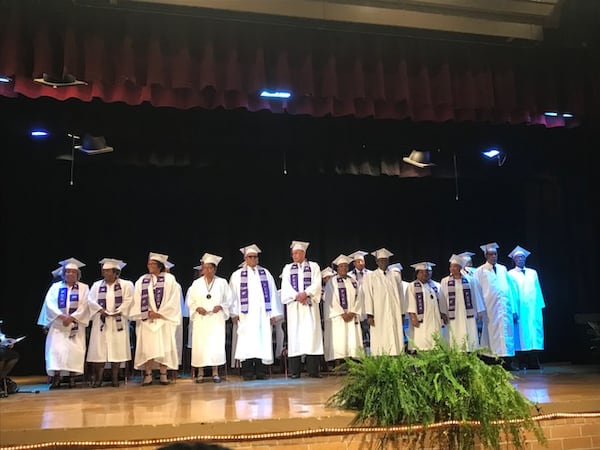 Pike County Consolidated High School's senior class of 1969 on stage at a ceremony on March 3, 2018, to receive their high school diplomas. ERIC STIRGUS / ESTIRGUS@AJC.COM