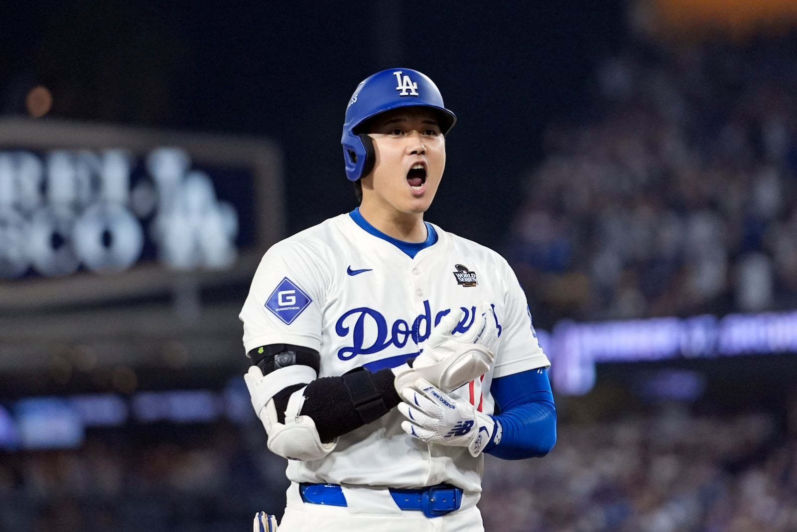 Los Angeles Dodgers' Shohei Ohtani reacts after advancing to third on a fielding error by New York Yankees second baseman Gleyber Torres during the eighth inning in Game 1 of the baseball World Series, Friday, Oct. 25, 2024, in Los Angeles. (AP Photo/Godofredo A. Vásquez)