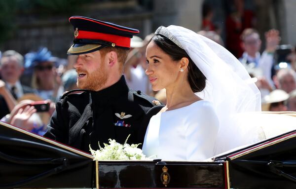 Meghan Markle and Prince Harry leave after their wedding at St. George's Chapel in Windsor Castle in Windsor, near London, England, Saturday, May 19, 2018. 