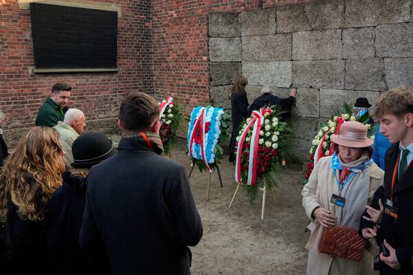 Survivors and relatives attend a ceremon at the Auschwitz-Birkenau former Nazi German concentration and extermination camp, in Oswiecim, Poland, Monday, Jan. 27. 2025. (AP Photo/Czarek Sokolowski)