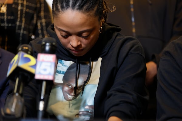 Darlene Chaney, wearing a hoodie with Cornelius Taylor’s image, reacts during a press conference where they discussed the findings of the Fulton County Medical Examiner’s Office regarding the cause of death of Cornelius Taylor on Thursday, January 30, in Decatur. Additionally, they provided information about the funeral plans.
(Miguel Martinez/ AJC)