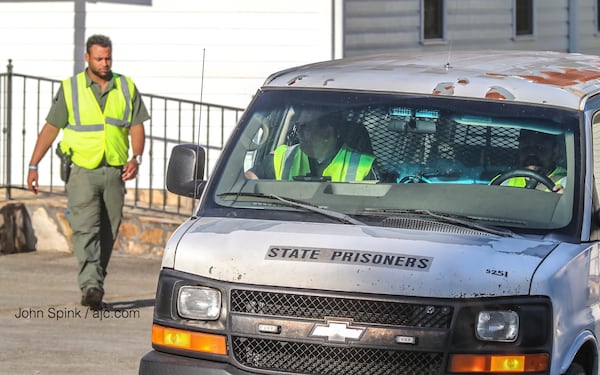 Officers with the Georgia Department of Corrections are staging at Faith Baptist Church on Miller Agan Road in Temple as the search for inmate Tommy Shane Morton continues Tuesday morning. 