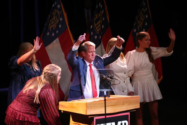 Gov. Brian Kemp acknowledges supporters with his family after being re-elected at Coca-Cola Roxy at the Battery, Tuesday, November 8, 2022, in Atlanta.  (Jason Getz / Jason.Getz@ajc.com)