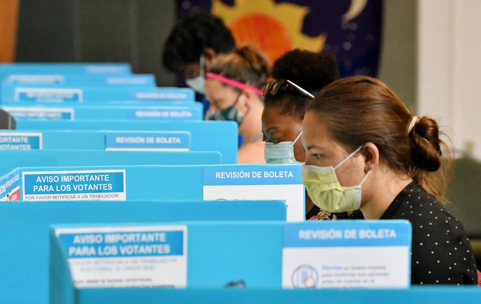 PHOTOS: Georgia voters struggle with long lines, new equipment, social distancing