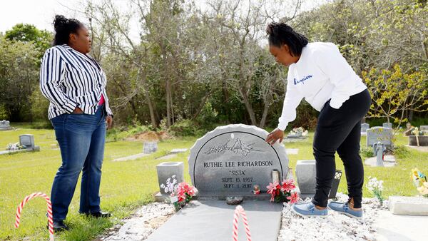 Bridget and Sharlene Richardson visit their mother Ruthie at Greenwood Cemetery in Tifton.