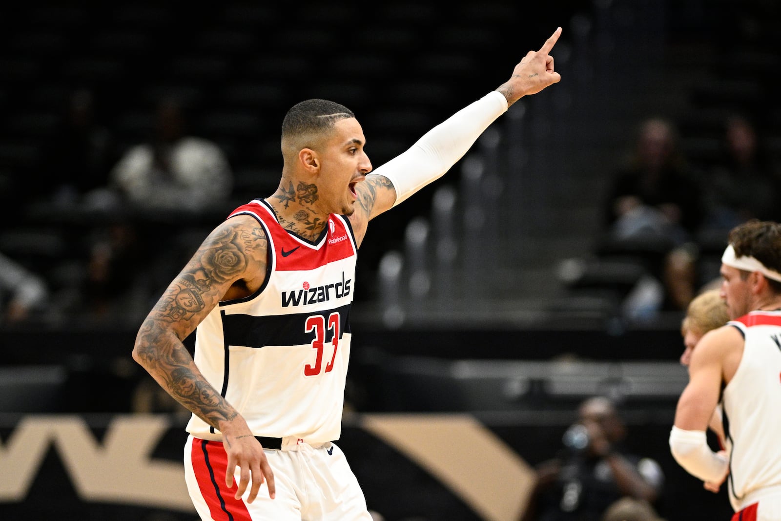 Washington Wizards forward Kyle Kuzma (33) gestures during the second half of an NBA preseason basketball game against the Toronto Raptors, Friday, Oct. 11, 2024, in Washington. (AP Photo/Nick Wass)