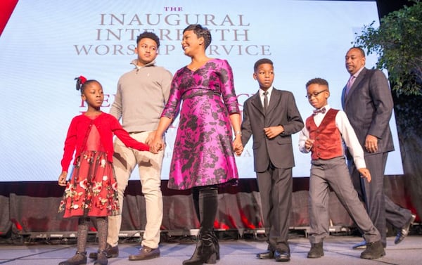 Keisha Lance Bottoms and her family take the stage during an interfaith worship service held at Impact Church in East Point, Tuesday on the day of Bottoms' inauguration as mayor. ALYSSA POINTER/ALYSSA.POINTER@AJC.COM