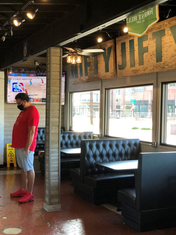 A customer waits for his order at Taylor’d Bar-B-Q in Avondale Estates, open now for takeout only. CONTRIBUTED BY WENDELL BROCK
