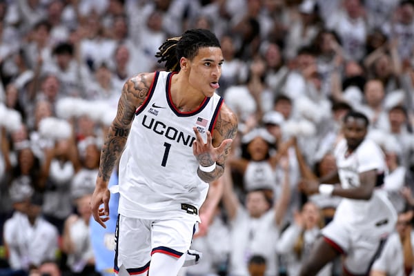 UConn guard Solo Ball (1) gestures after making a basket during the first half of an NCAA basketball game against Marquette, Wednesday, March 5, 2025, in Storrs, Conn. (AP Photo/Jessica Hill)