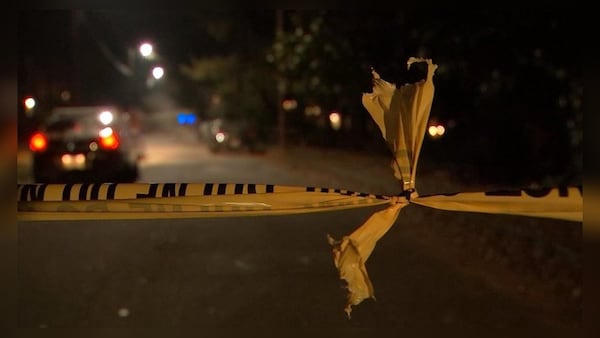 Police are investigating a shooting that left a woman dead in a car with a 1-year-old girl inside in DeKalb County. (Credit: Channel 2 Action News)