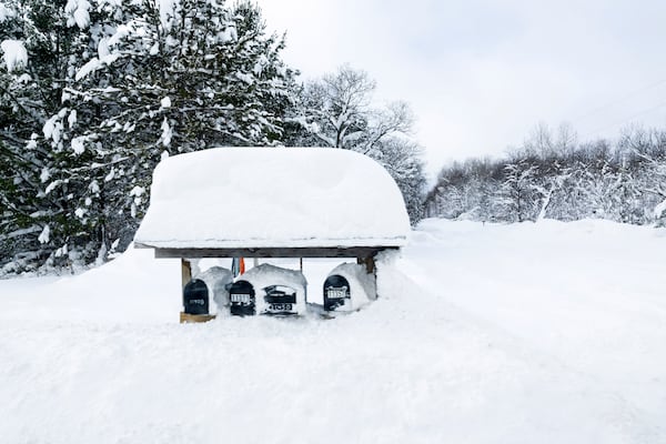 Mailboxes covered in snow in Antrim County, Mich. on Sunday, Dec. 1, 2024. (Joel Bissell/Kalamazoo Gazette via AP)