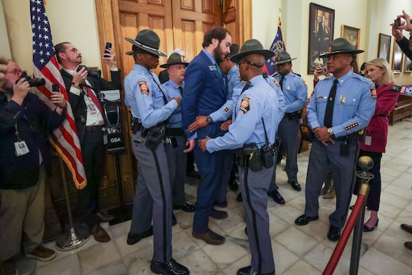 Sen. Colton Moore, R-Trenton, is detained by Georgia State Patrol as Sen. Moore attempted to enter the state House of Representatives for the state of the state address at the Georgia Capitol, Thursday, Jan. 16, 2025, in Atlanta. Sen. Moore was banned from the House last year after comments he made about the late House Speaker David Ralston. (Jason Getz / AJC)