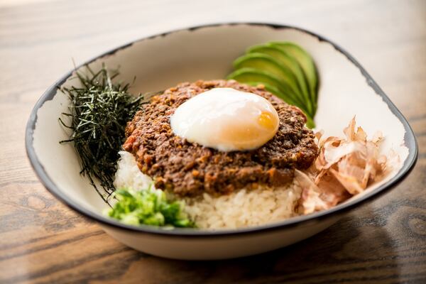 Momonoki Dry Curry with ground beef, carrots, avocado, scallions, bonito flakes, poached egg, kizami nori, and rice. Photo credit- Mia Yakel