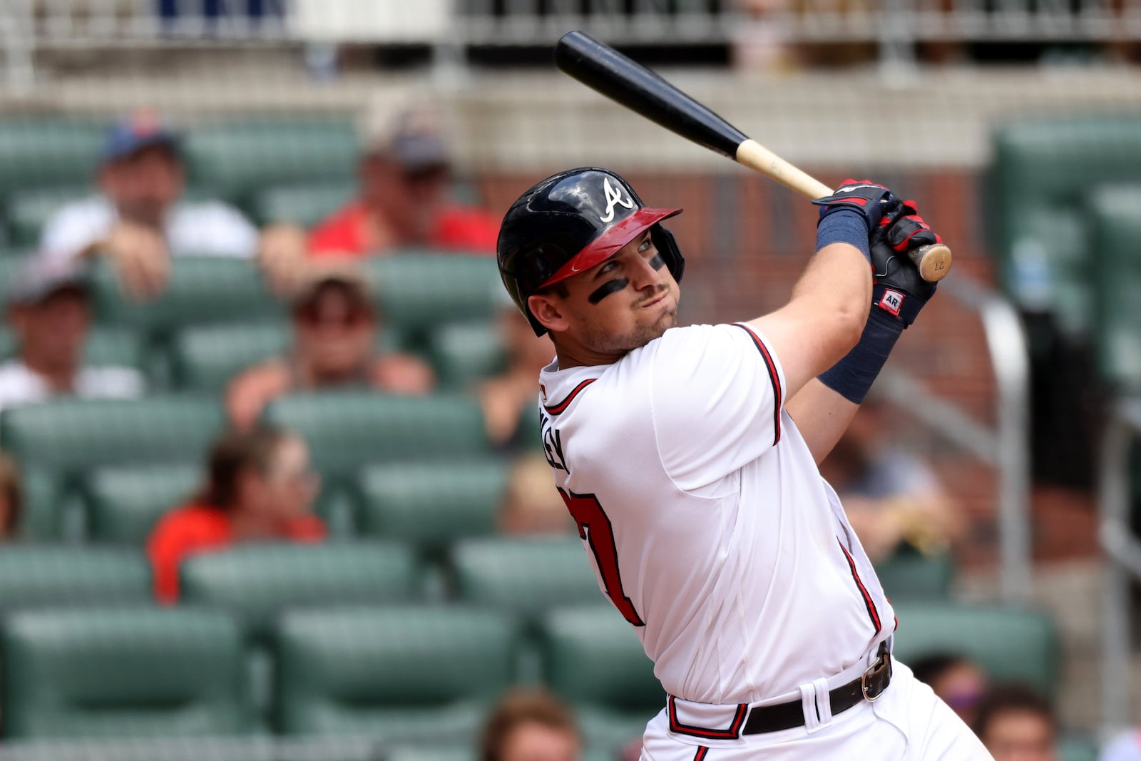 Braves third baseman Austin Riley hits a solo home run during the eighth inning against the New York Mets at Truist Park Wednesday, July 13, 2022, in Atlanta. (Jason Getz / Jason.Getz@ajc.com)