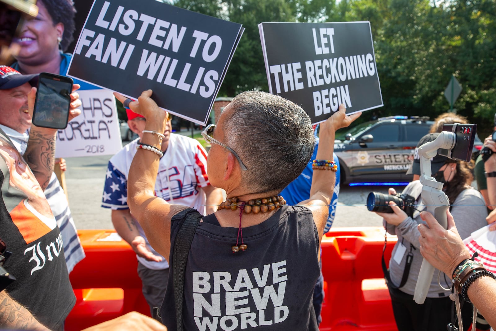 Protesters at the Fulton County Jail waiting for Trump’s arrival in Atlanta on Thursday, August 24, 2023. (Katelyn Myrick/katelyn.myrick@ajc.com)