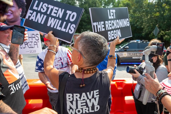 Protesters at the Fulton County Jail waiting for Trump’s arrival in Atlanta on Thursday, August 24, 2023. (Katelyn Myrick/katelyn.myrick@ajc.com)