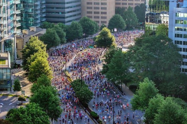 Aerial view shows runners going south on Peactree Road toward Piedmont Park during the 55th Atlanta Journal-Constitution Peachtree Road Race in Atlanta on Thursday, July 4, 2024. 
(Miguel Martinez / AJC)