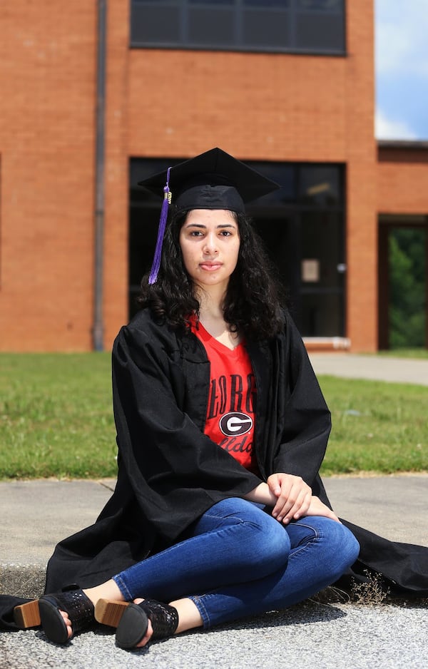 Yara Manasrah poses for a portrait on Sunday, June 14, 2020, at Chapel Hill High School in Douglasville, Georgia. Thousands of K-12 schools and colleges closed in the middle of the spring semester this year due to the coronavirus pandemic. For high school and college seniors, the closure not only meant the end of in-person classes, but also no traditional senior rituals like prom and graduation. CHRISTINA MATACOTTA FOR THE ATLANTA JOURNAL-CONSTITUTION.