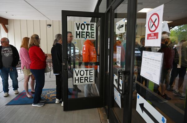 Voters line up to enter North Cobb Senior Center during the advance voting, Tuesday, October 15, 2024, in Acworth. (Hyosub Shin / AJC)