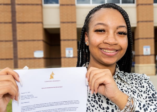 Westlake High School senior Makenzie Thompson proudly holds her recruiment letter from Tuskegee University, which she accepted. For PHIL SKINNER FOR THE AJC