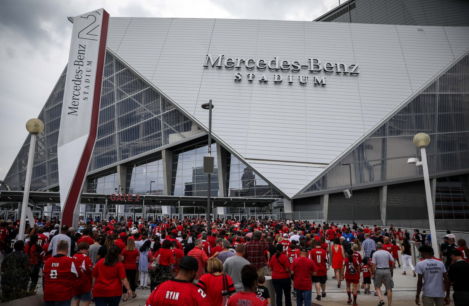 Fans enter the Mercedes-Benz Stadium, the new home of the Atlanta Falcons, before a pre-season game against the Arizona Cardinals, Saturday, Aug. 26, 2017, in Atlanta.  BRANDEN CAMP/SPECIAL